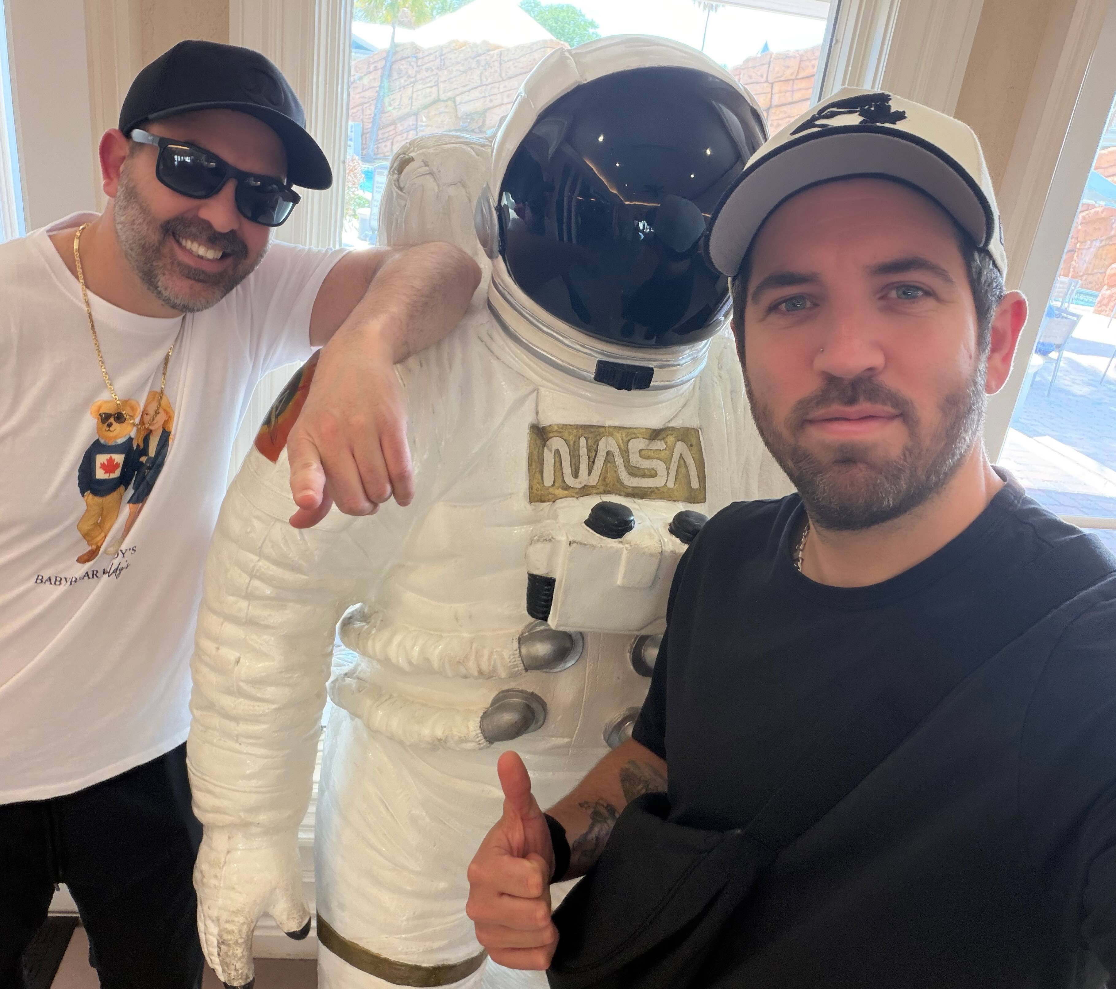 Schreiber and Carson pose with an astronaut suit