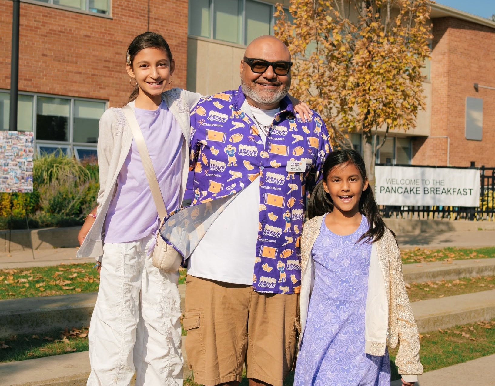 Kevin Lad with his daughters at Homecoming