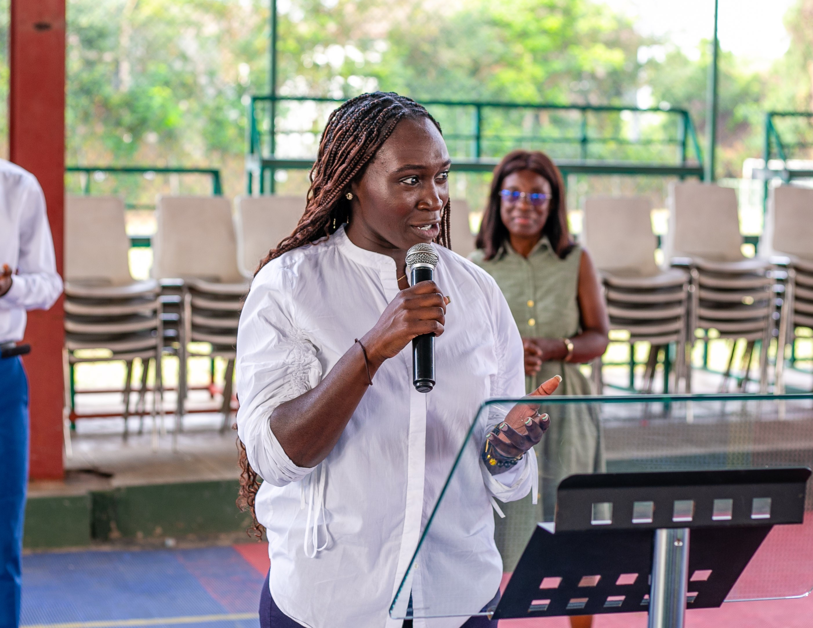 Doreen speaking at a podium