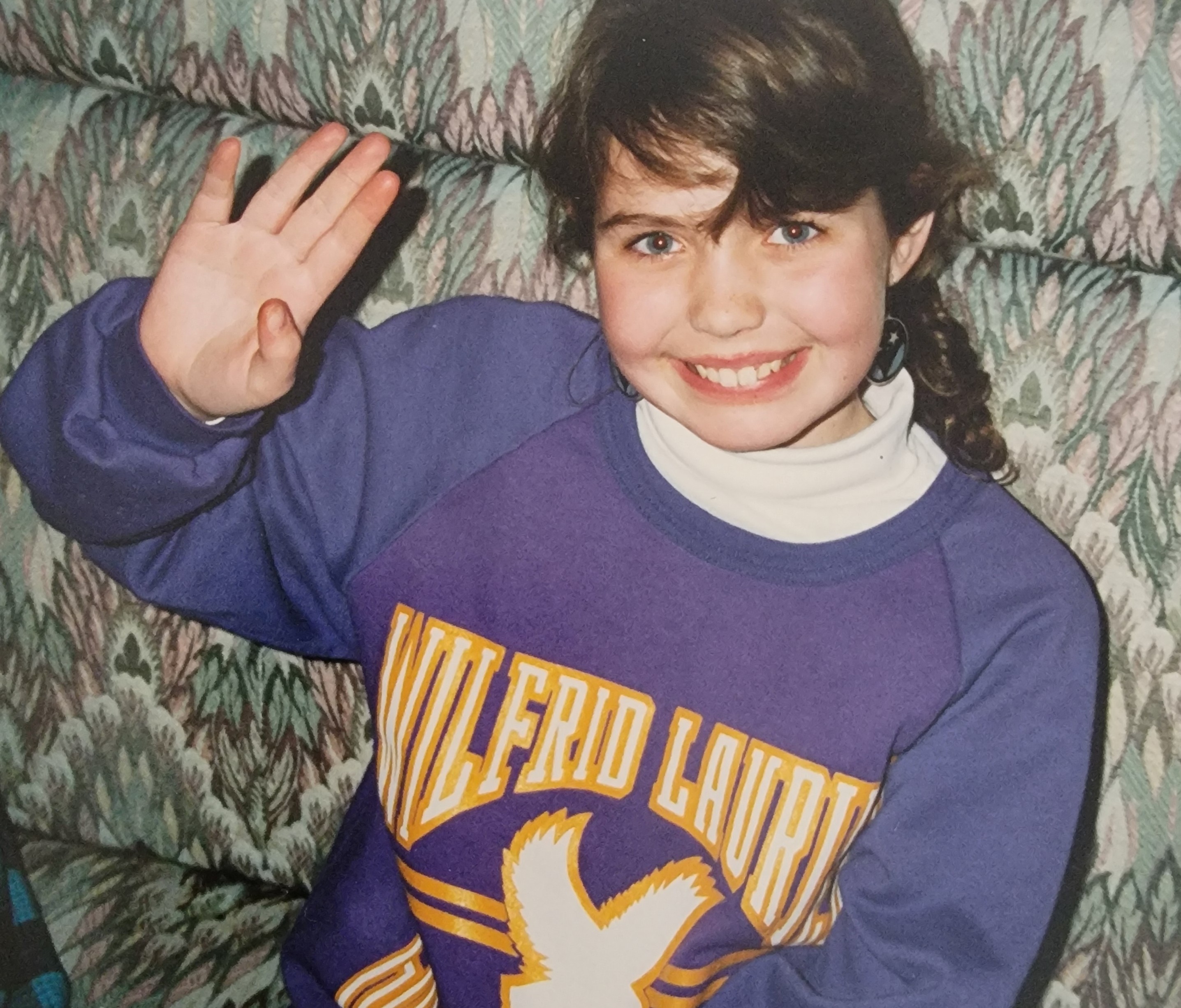Maple as a child in her Laurier sweater